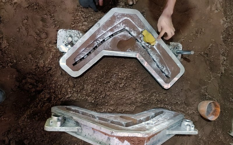 Sand casting — pouring molten metal into the mould